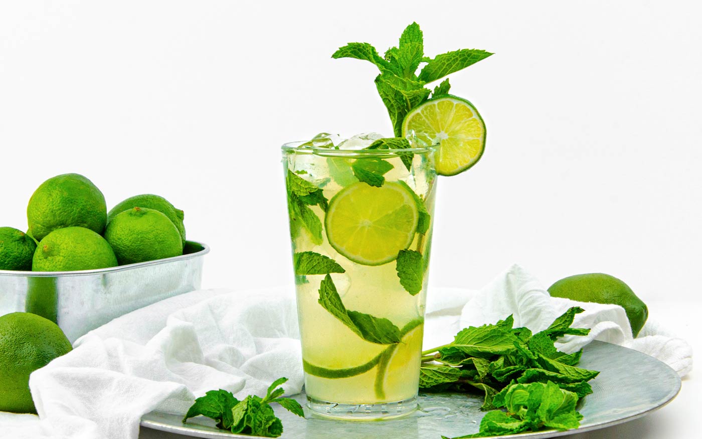 Add mint, lime, sugar, and soda